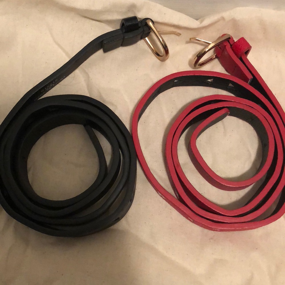 Two s/m leather belts in black and red